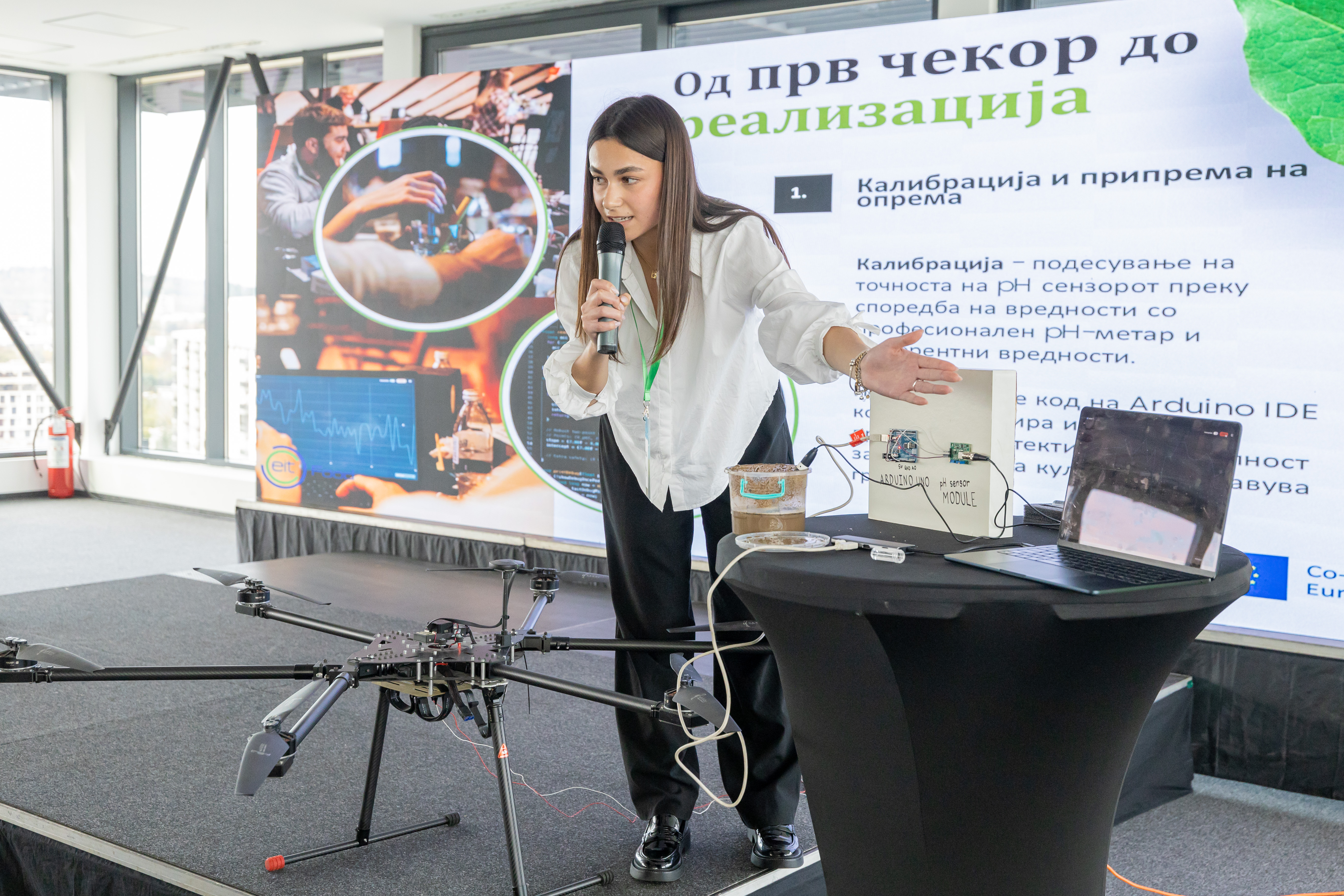 Presenter explaining the Agri-pHLy system to the jury